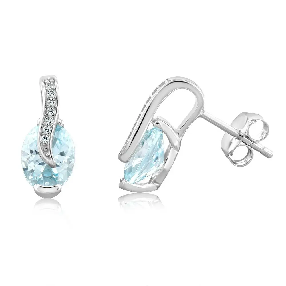 Sterling Silver Rhodium Plated Light Blue And White CZ Crossover Stud Earrings