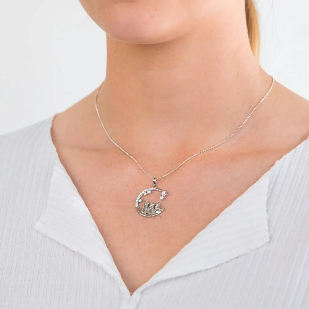 Sterling Silver And Rhodium Cubic Zirconia Half Moon With Three Sisters Pendant