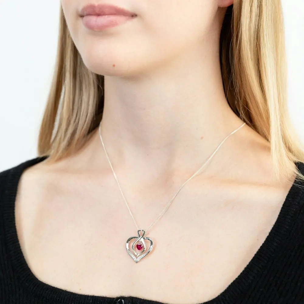 Sterling Silver Rhodium Plated White CZ And Created Ruby Infinity On Heart Pendant