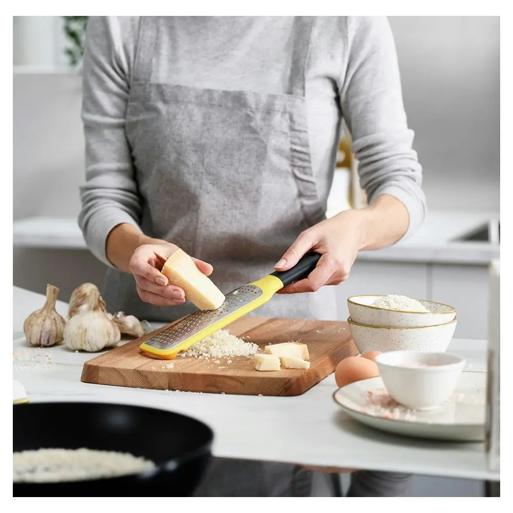 Joseph Joseph Grip Stainless Steel Coarse Paddle Grater with Bowl Grip Yellow