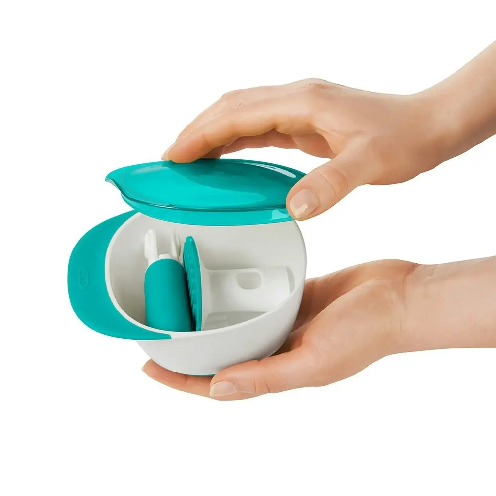 OXO Tot Compact Portable Baby Food Masher Teal With Masher Teeth And Steep Bowl