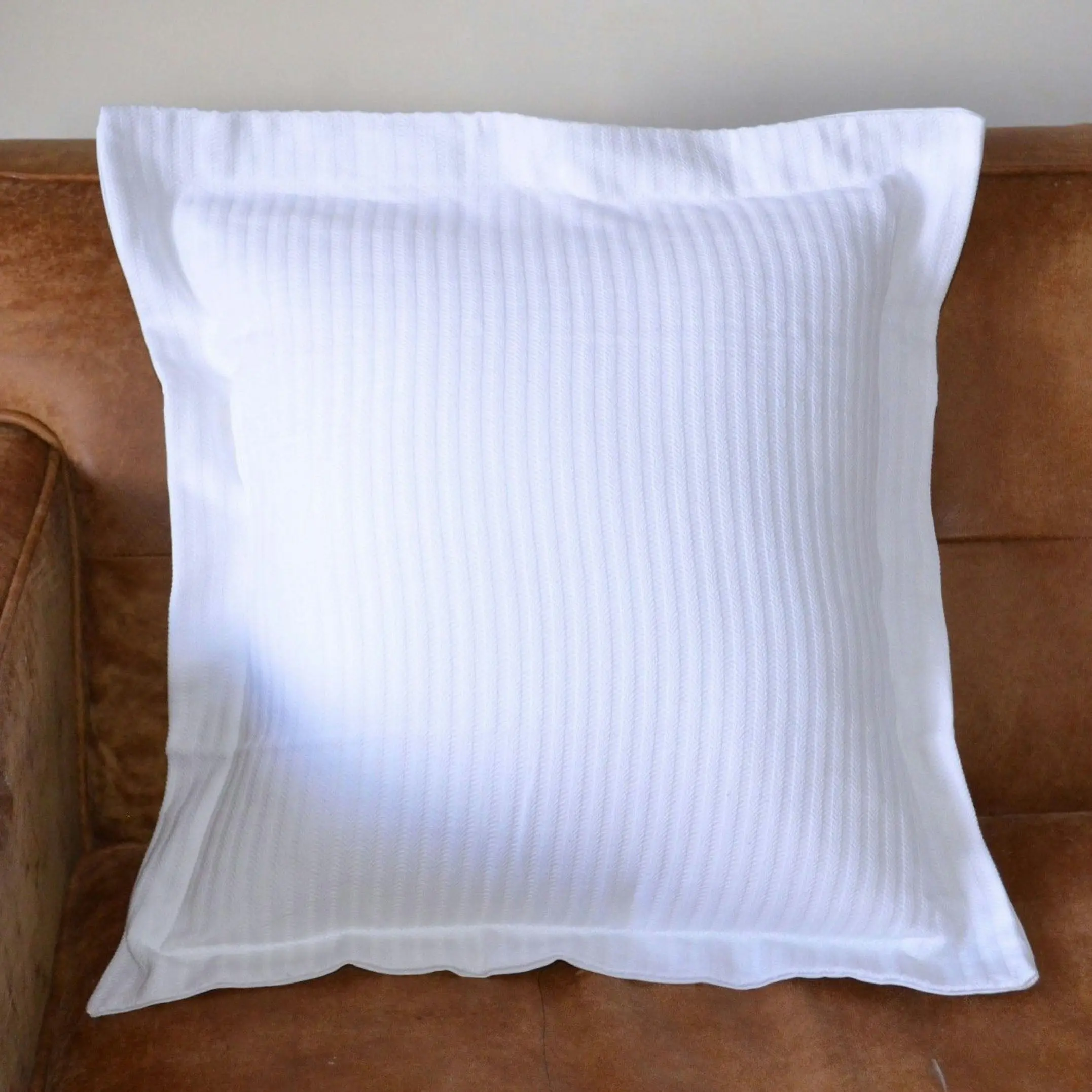 A pair of 100% Cotton White Herringbone Standard or European Pillow Covers